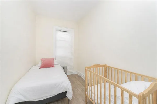 a bedroom with a bed and a table
