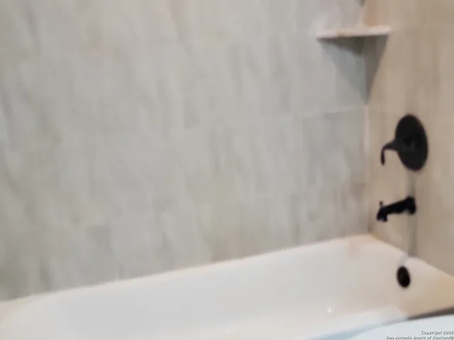 a bathroom with a bathtub