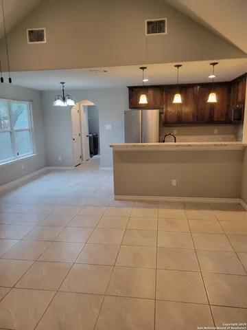 a view of a kitchen with a sink and a stove