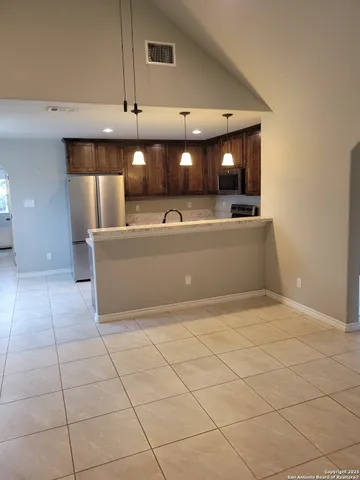 a view of a kitchen with a sink