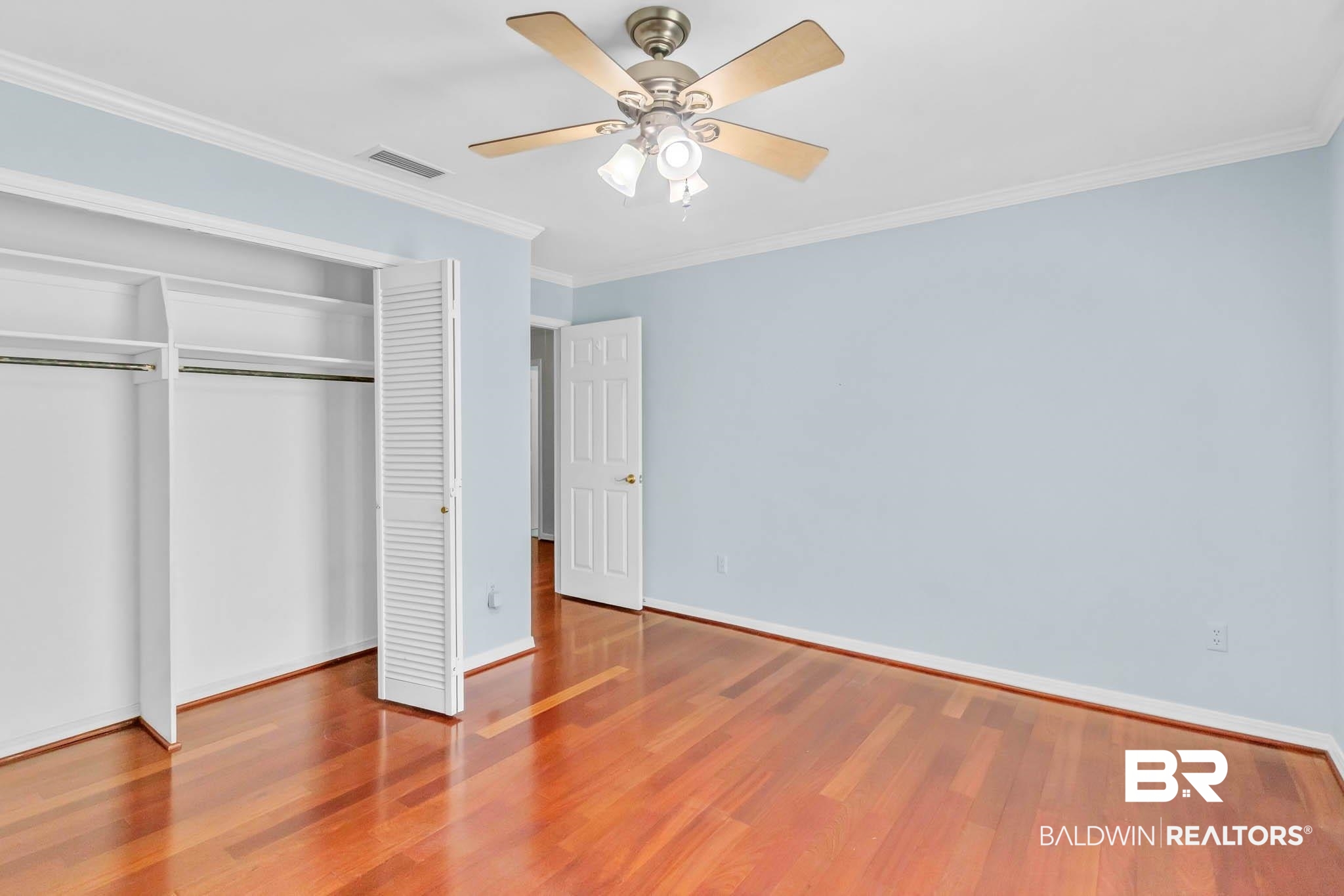 309 West Brandy Run Road Mobile, AL 36608 - Photo 52 of 100 Unfurnished bedroom with wood finished floors, ornamental molding, a closet, and ceiling fan