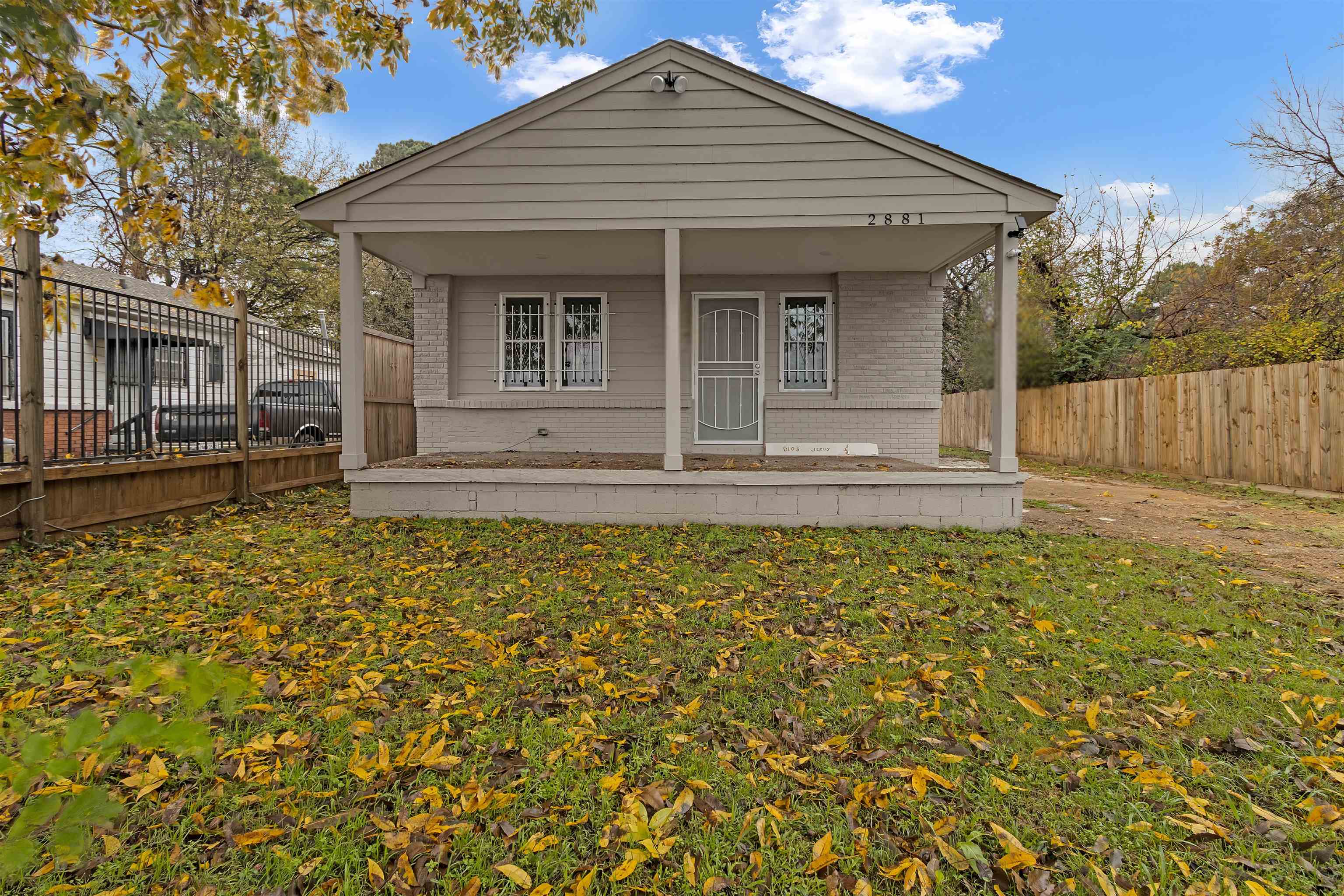 front view of a house with a yard