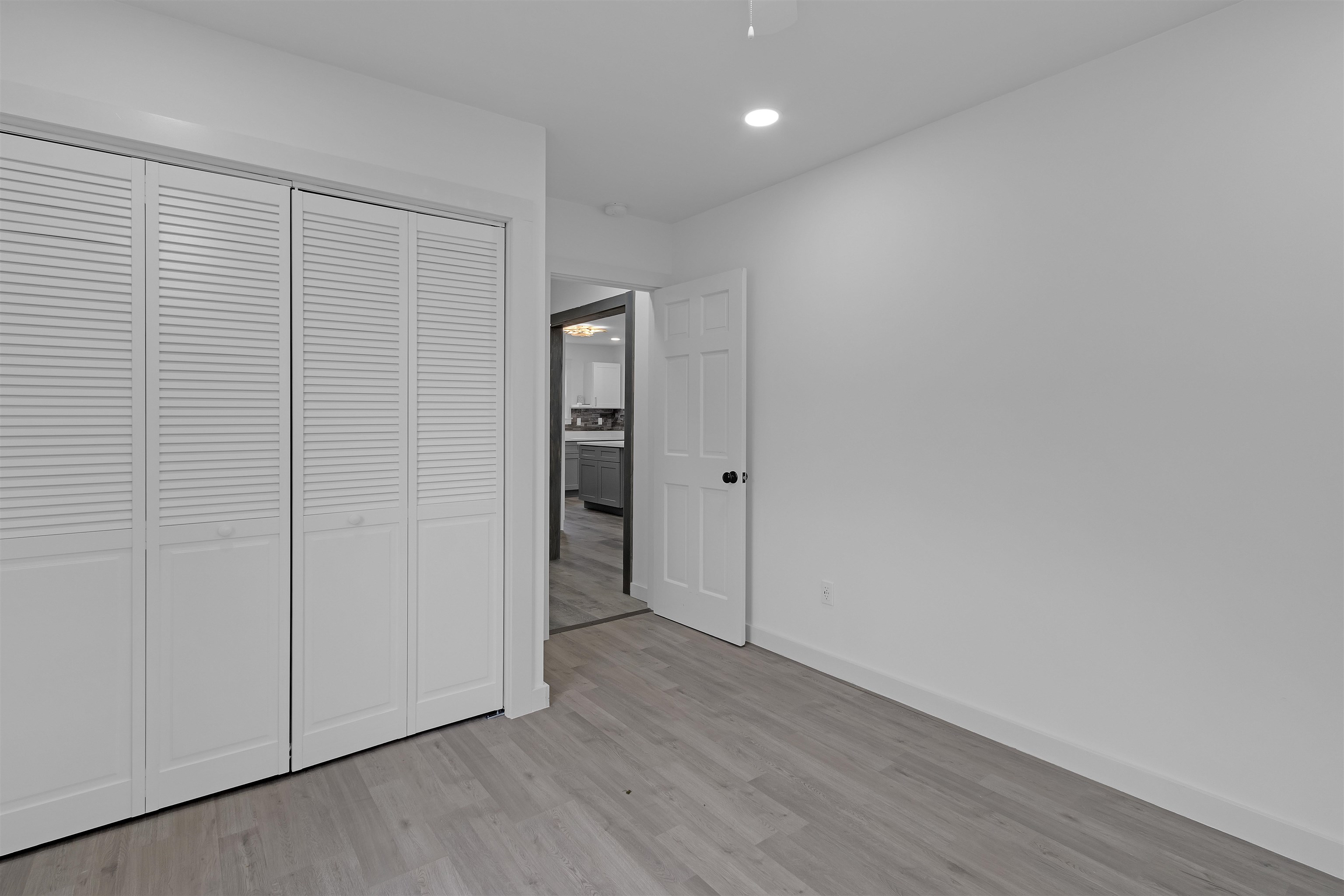 2881 Tutwiler Avenue Memphis, TN 38112 - Photo 15 of 23 Unfurnished bedroom with light wood-style floors, a closet, and recessed lighting