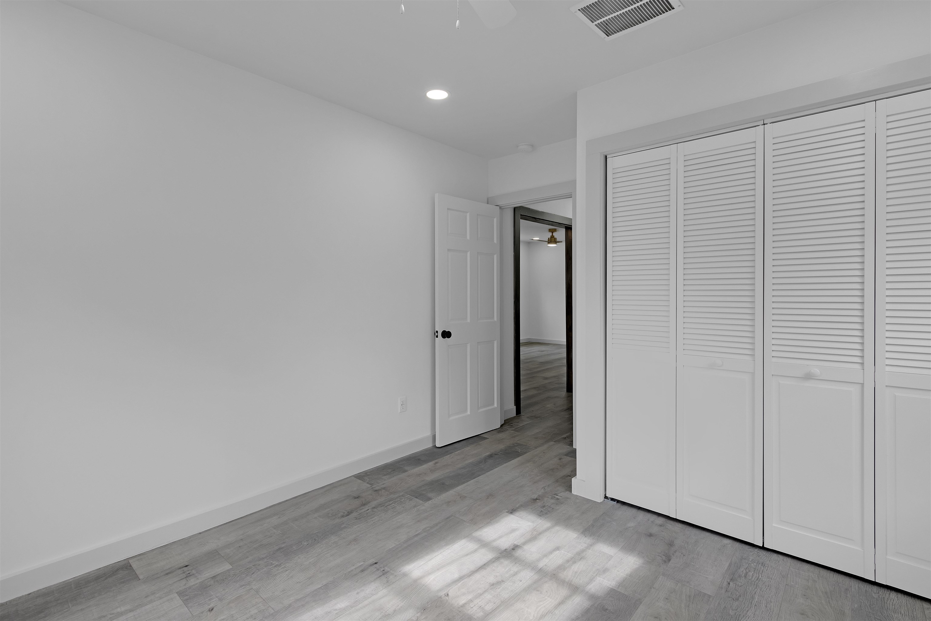 2881 Tutwiler Avenue Memphis, TN 38112 - Photo 19 of 23 Unfurnished bedroom with recessed lighting, a closet, light wood finished floors, and a ceiling fan