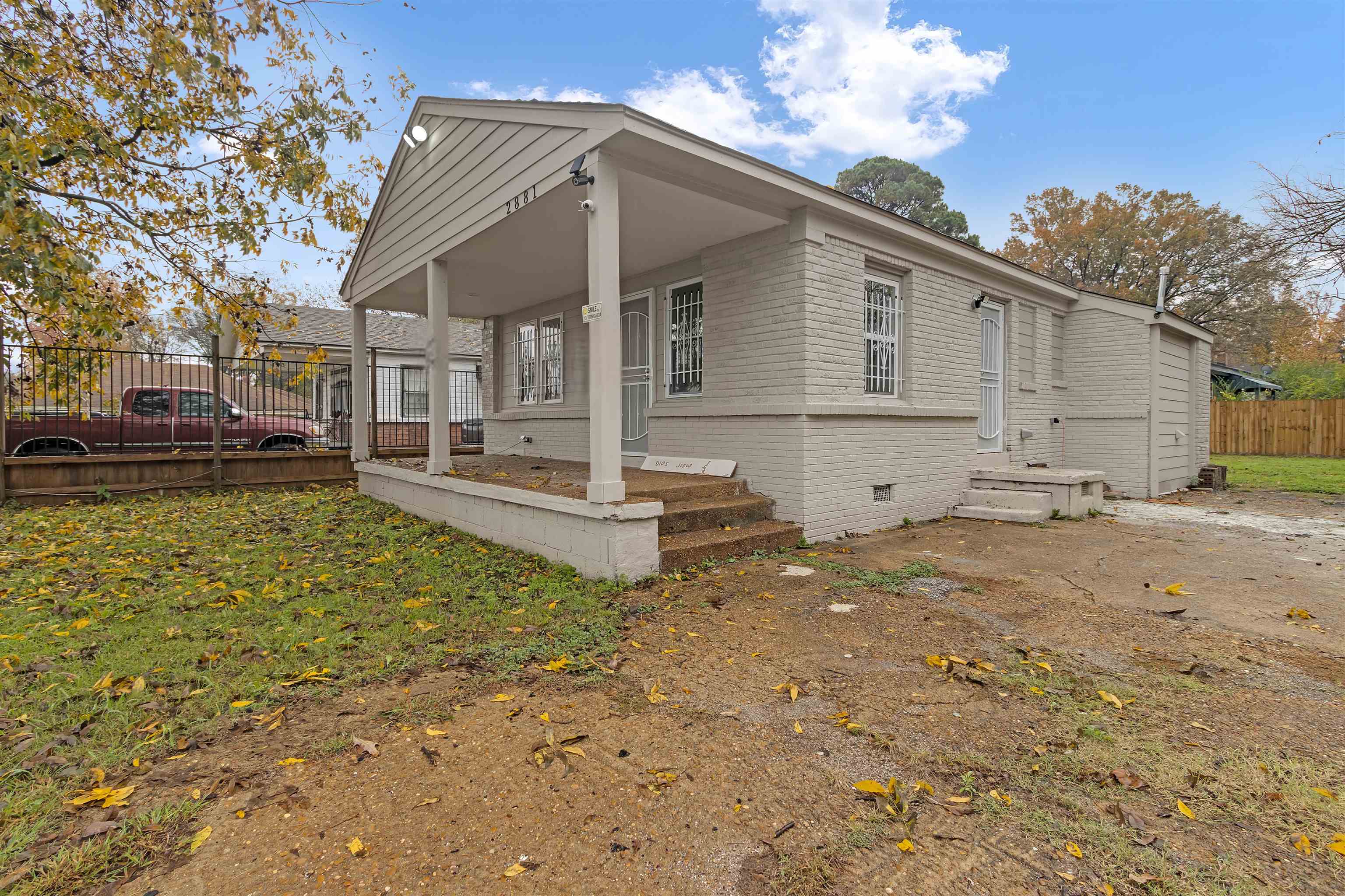 2881 Tutwiler Avenue Memphis, TN 38112 - Photo 2 of 23 View of front of home featuring brick siding, crawl space, and a porch