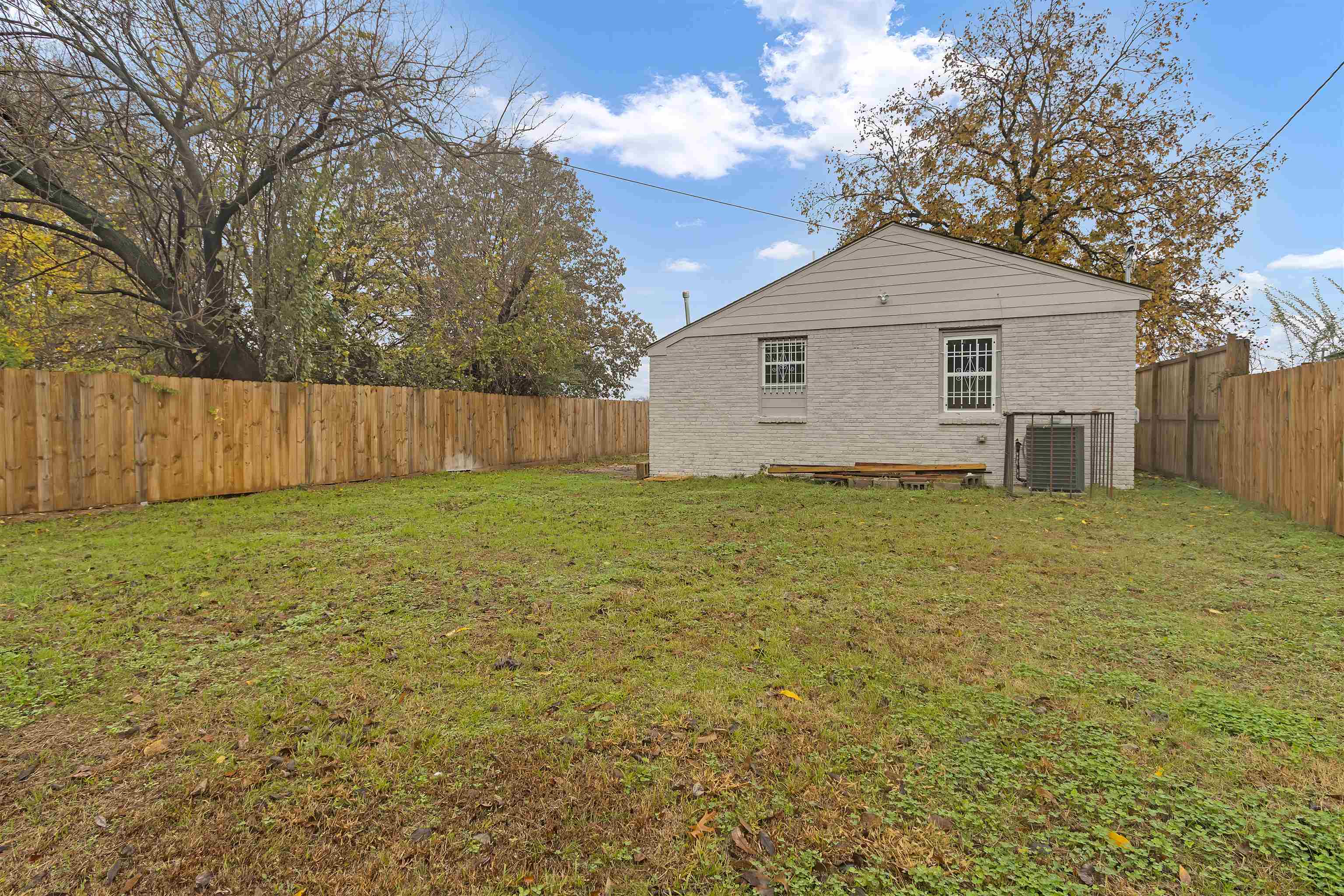2881 Tutwiler Avenue Memphis, TN 38112 - Photo 23 of 23 View of property exterior with a fenced backyard and brick siding