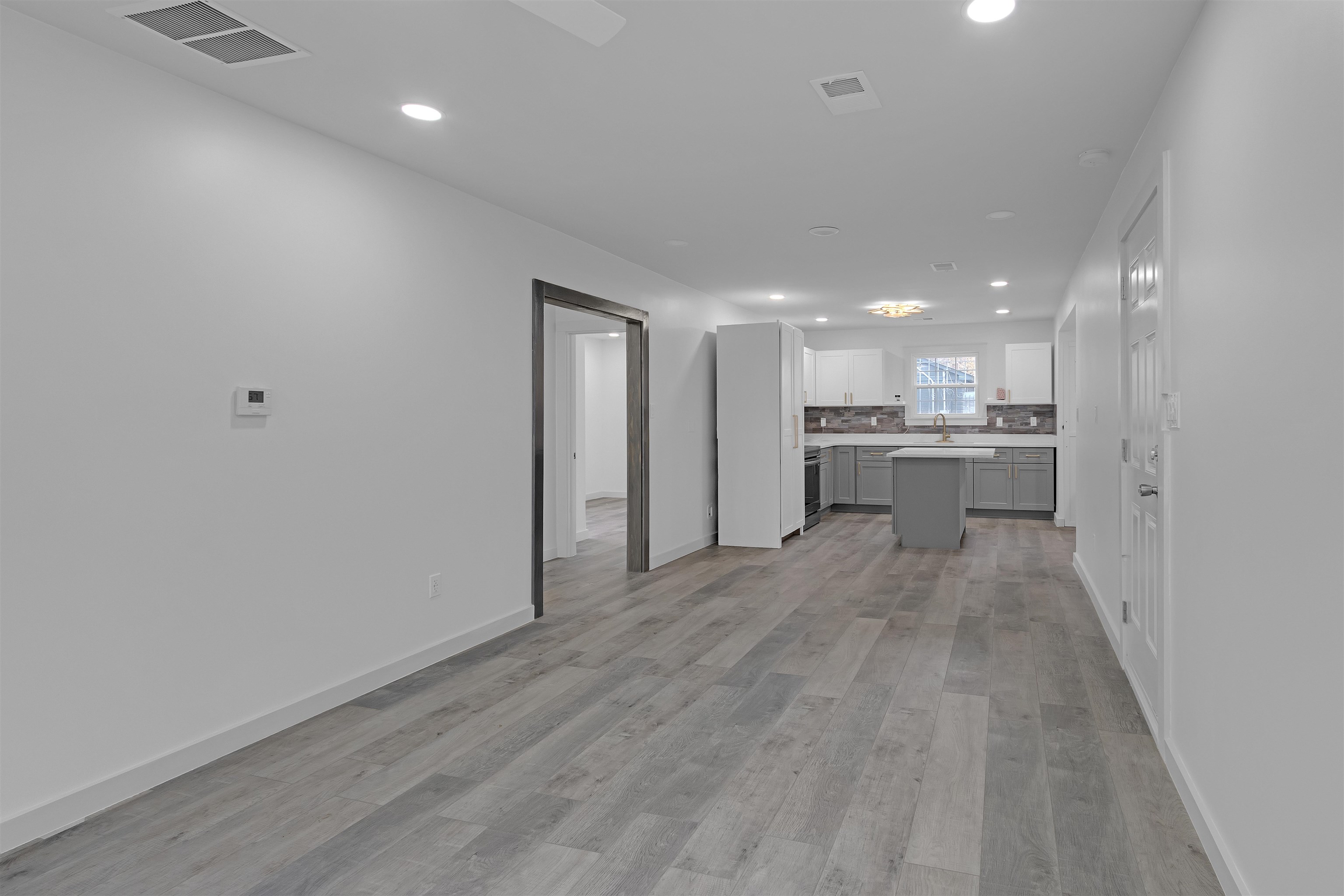 2881 Tutwiler Avenue Memphis, TN 38112 - Photo 5 of 23 Unfurnished living room featuring light wood-type flooring and recessed lighting