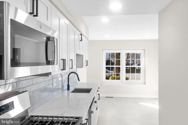 a bathroom with a sink and a window