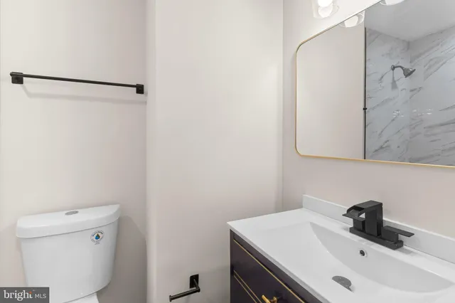 a bathroom with a sink and a toilet