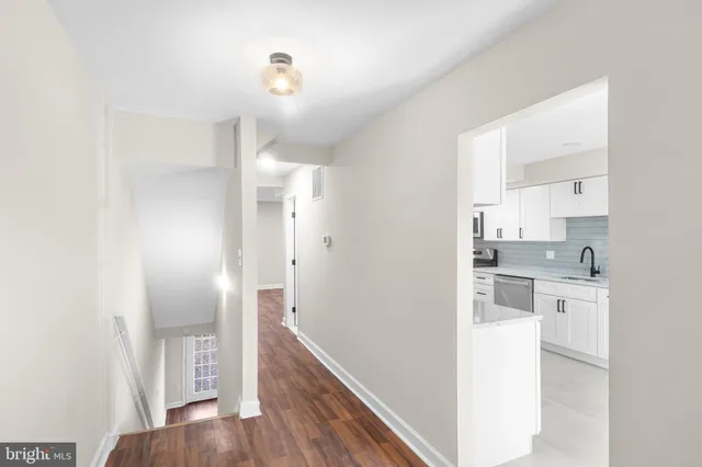 a kitchen with cabinets and a window