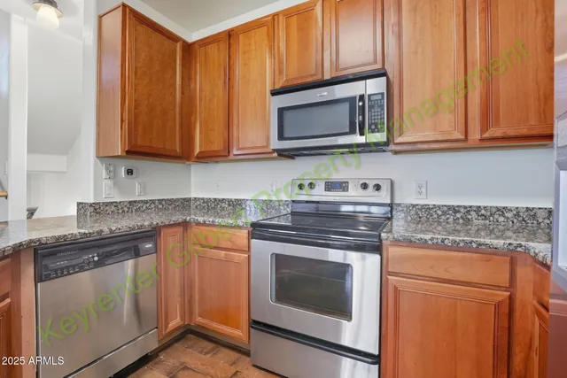 a view of kitchen with sink and wooden floor