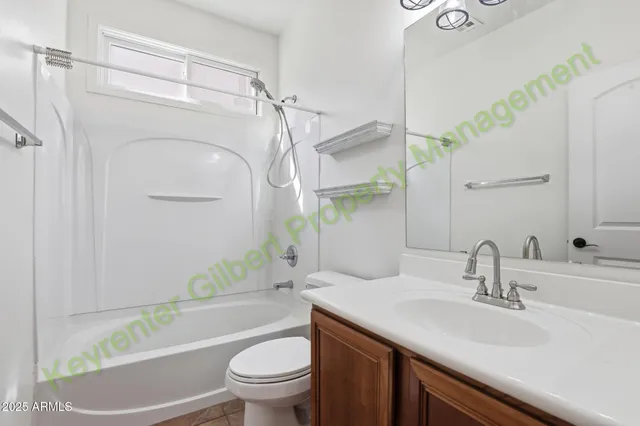 a kitchen with stainless steel appliances granite countertop a refrigerator a stove a sink and a microwave