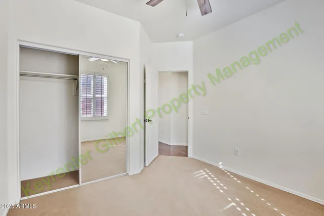a kitchen with metallic refrigerator freezer and a granite counter tops