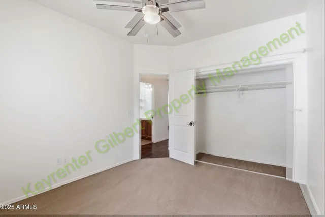a bathroom with a granite countertop sink a mirror and a shower