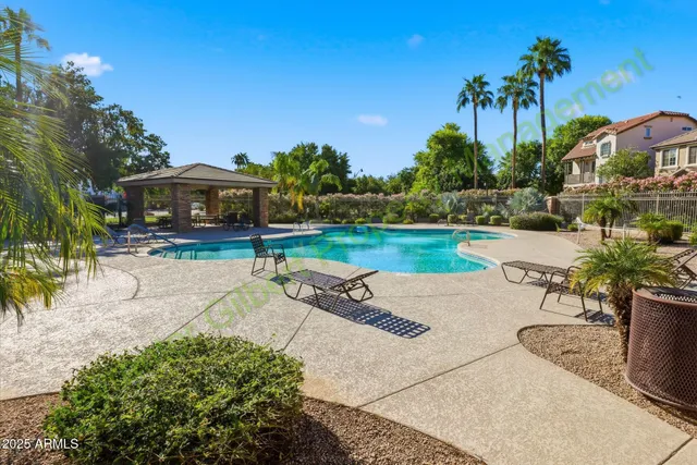 a picture of a bench in front of a building