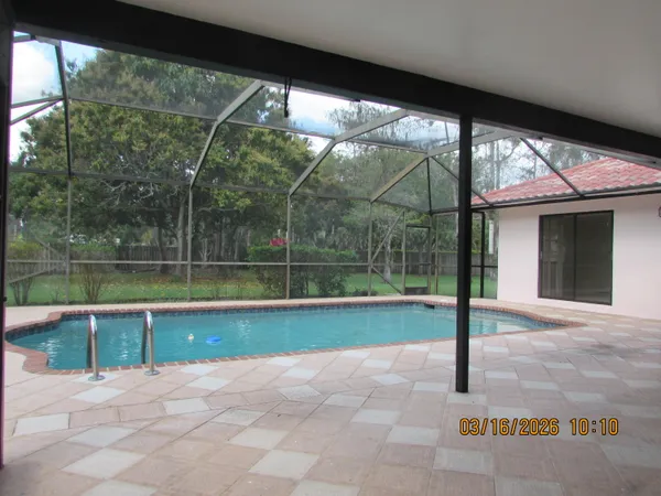 a view of a swimming pool with a porch