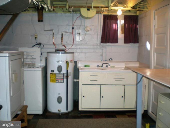 2115 Stonewall Road Catonsville, MD 21228 - Photo 17 of 19 a utility room with cabinets