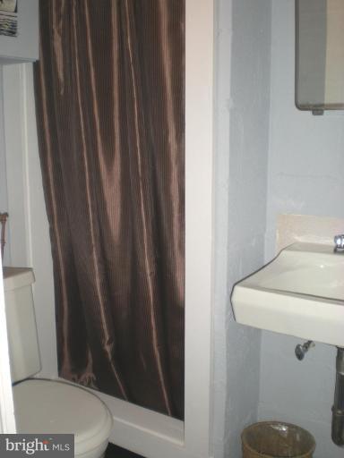 2115 Stonewall Road Catonsville, MD 21228 - Photo 19 of 19 a bathroom with a sink and toilet