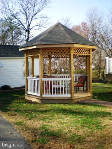 2115 Stonewall Road Catonsville, MD 21228 - Photo 3 of 19 a view of a house with a yard and deck