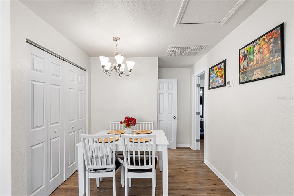 515 Walnut Street Auburndale, FL 33823 - Photo 12 of 43 a view of a dining room with furniture and wooden floor
