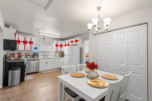 a kitchen with a white cabinets and white appliances