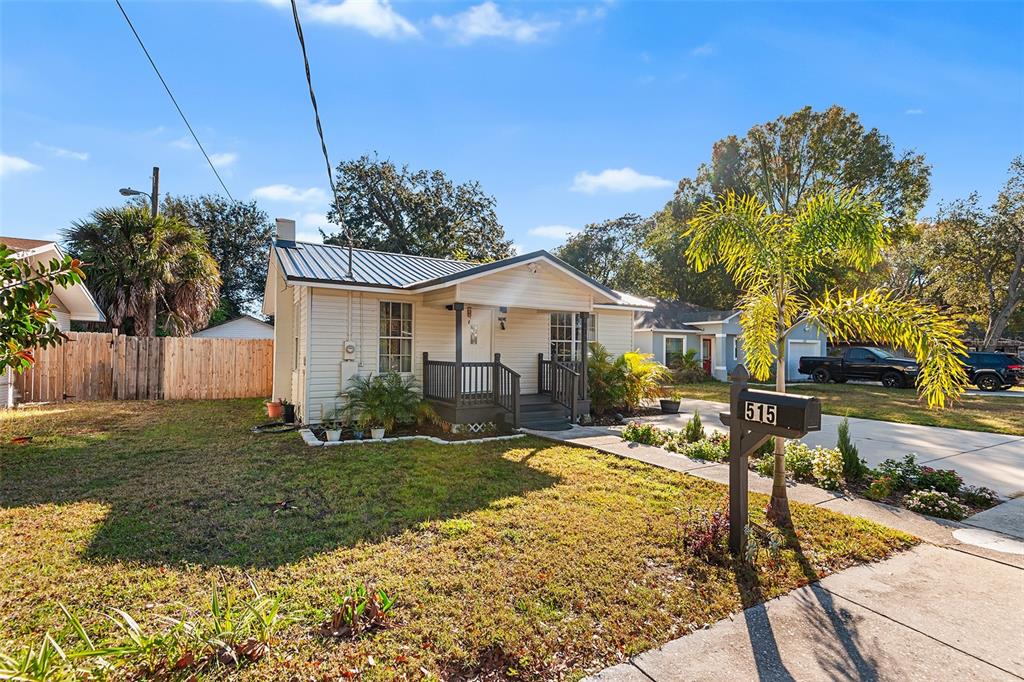 515 Walnut Street Auburndale, FL 33823 - Photo 2 of 43 a front view of a house with garden