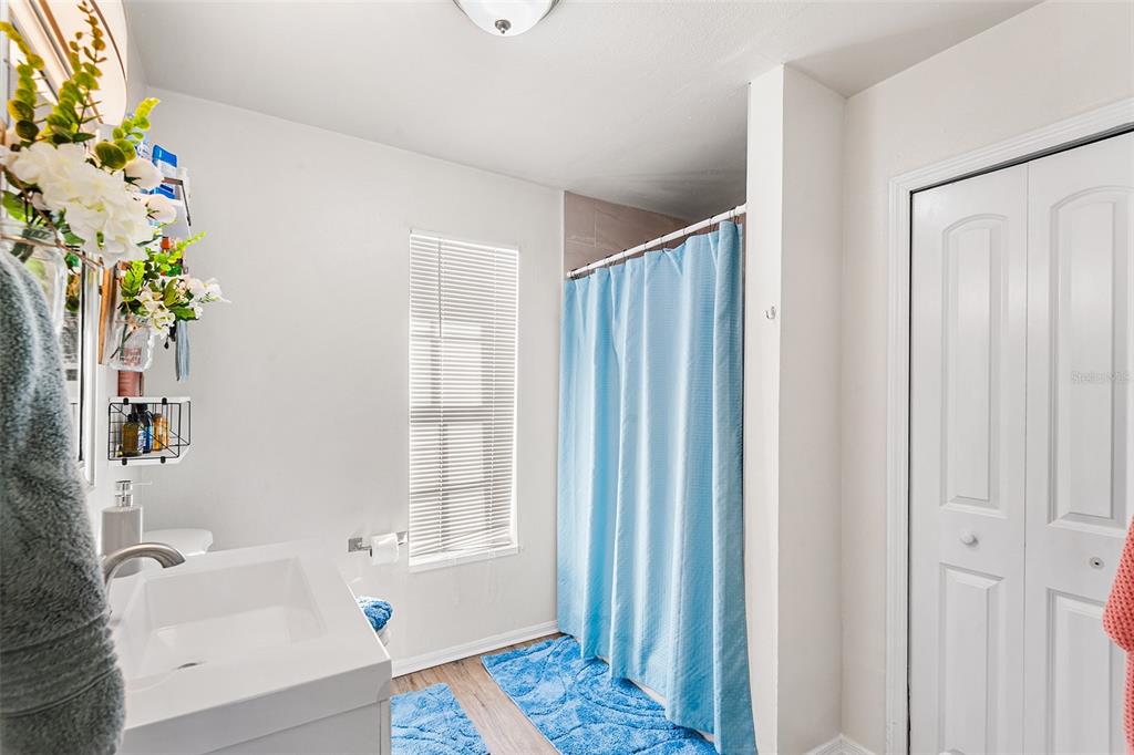 515 Walnut Street Auburndale, FL 33823 - Photo 24 of 43 a bathroom with a bathtub and a shower