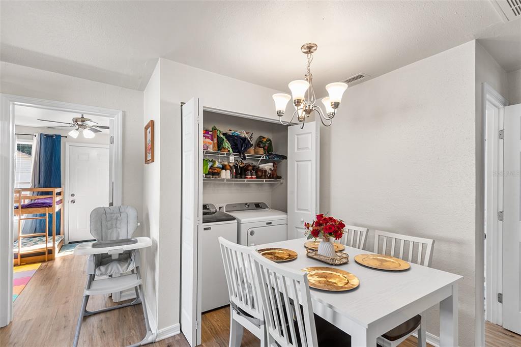 515 Walnut Street Auburndale, FL 33823 - Photo 26 of 43 a view of a dining room with furniture and chandelier