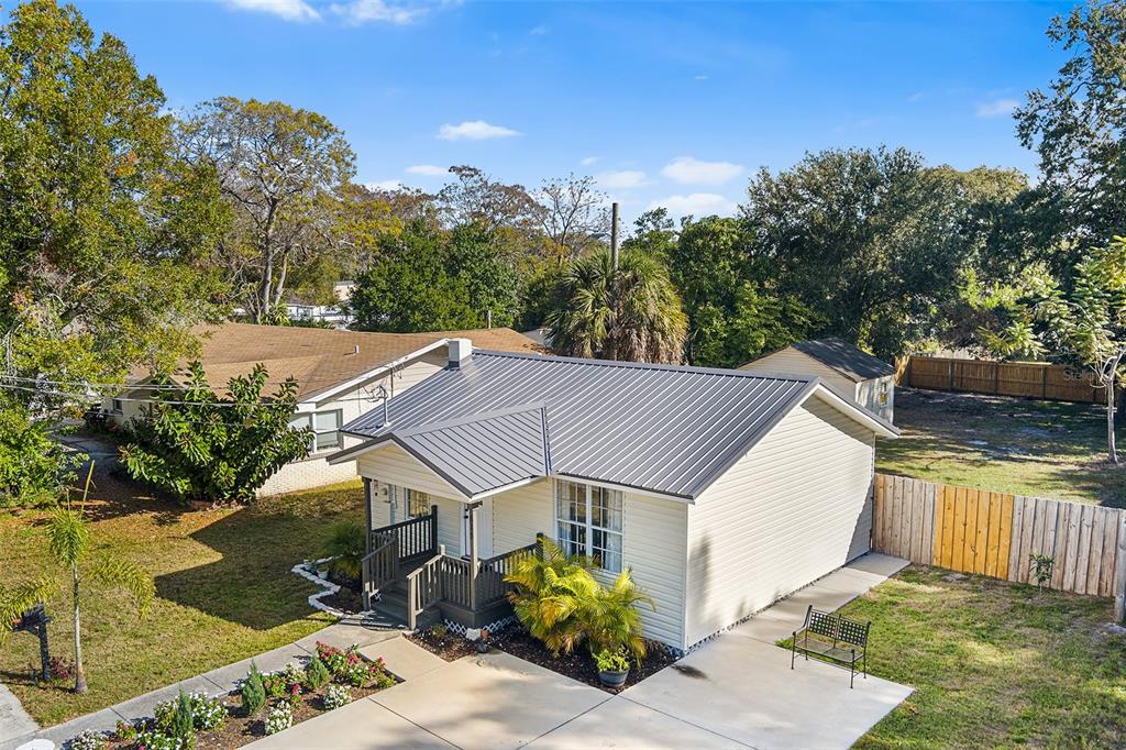 515 Walnut Street Auburndale, FL 33823 - Photo 31 of 45 a view of a house with wooden fence next to a yard