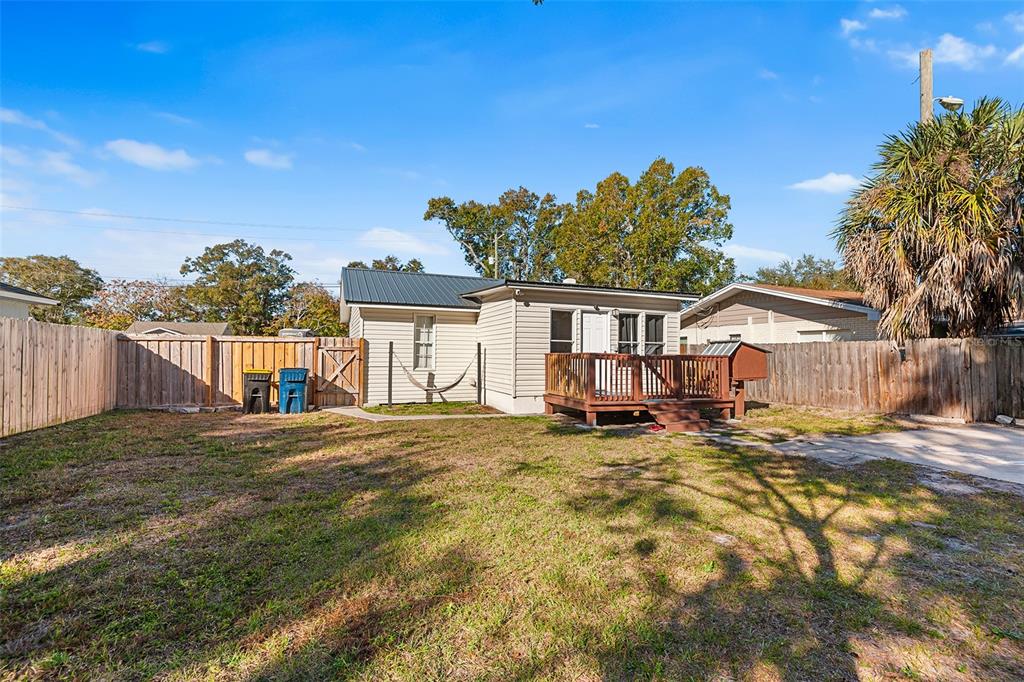 515 Walnut Street Auburndale, FL 33823 - Photo 4 of 45 a view of a house with backyard and a tree