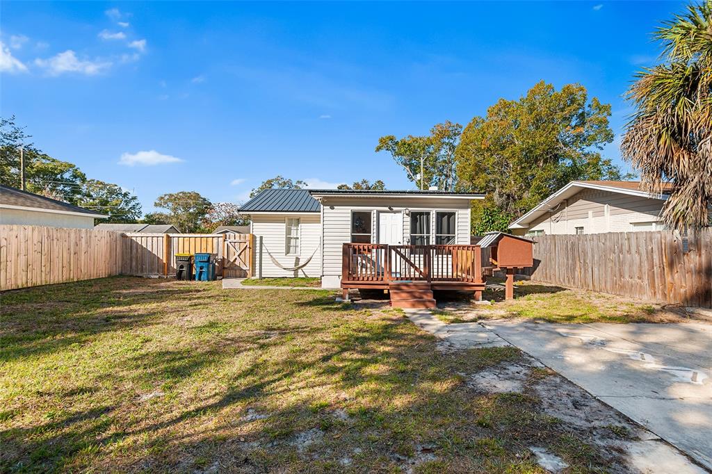 515 Walnut Street Auburndale, FL 33823 - Photo 5 of 45 a view of a house with backyard porch and sitting area