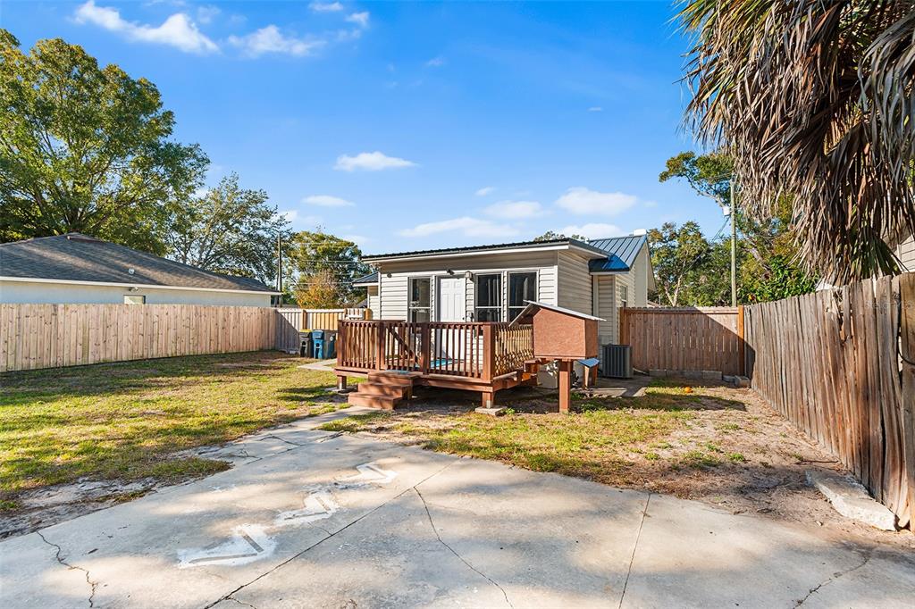 515 Walnut Street Auburndale, FL 33823 - Photo 7 of 43 a view of a house with wooden floor and a fence