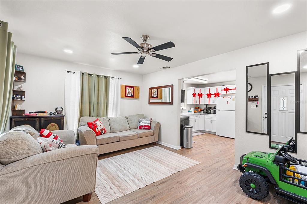 515 Walnut Street Auburndale, FL 33823 - Photo 8 of 43 a living room with furniture and a wooden floor