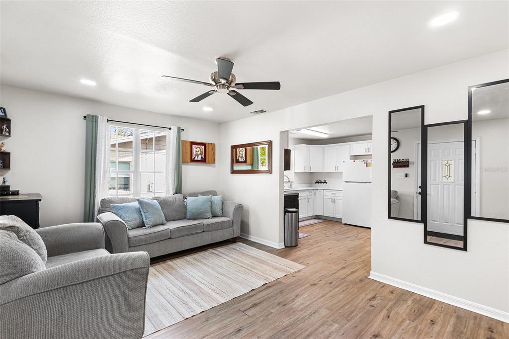 515 Walnut Street Auburndale, FL 33823 - Photo 9 of 45 a living room with furniture and kitchen view