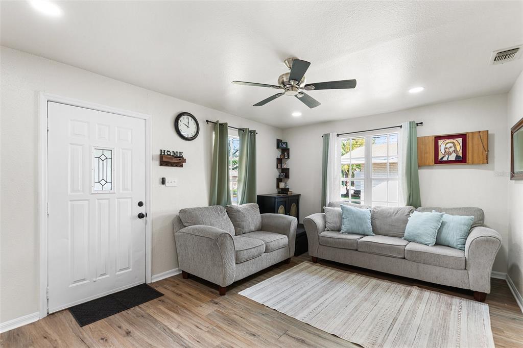 515 Walnut Street Auburndale, FL 33823 - Photo 10 of 45 a living room with furniture and a large window