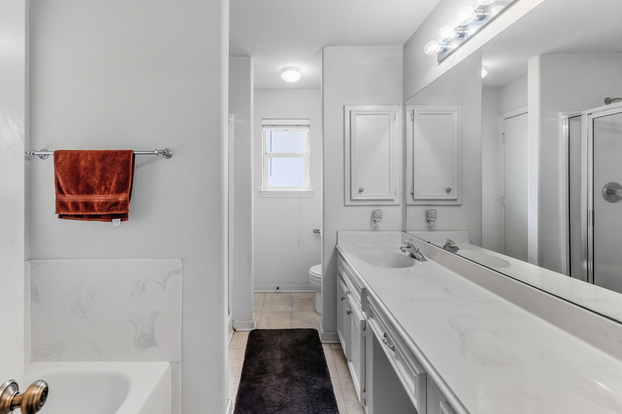 691 Bishop Road Huntsville, TX 77320 - Photo 18 of 32 a bathroom with a sink a toilet and shower