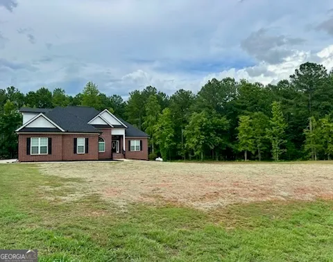 a house with trees in the background