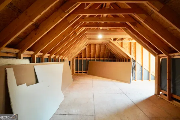 a spacious bathroom with a granite countertop sink and a mirror