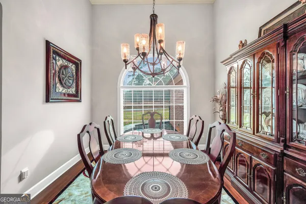 a living room with furniture fireplace and flat screen tv
