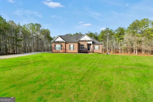 a view of a house with a big yard