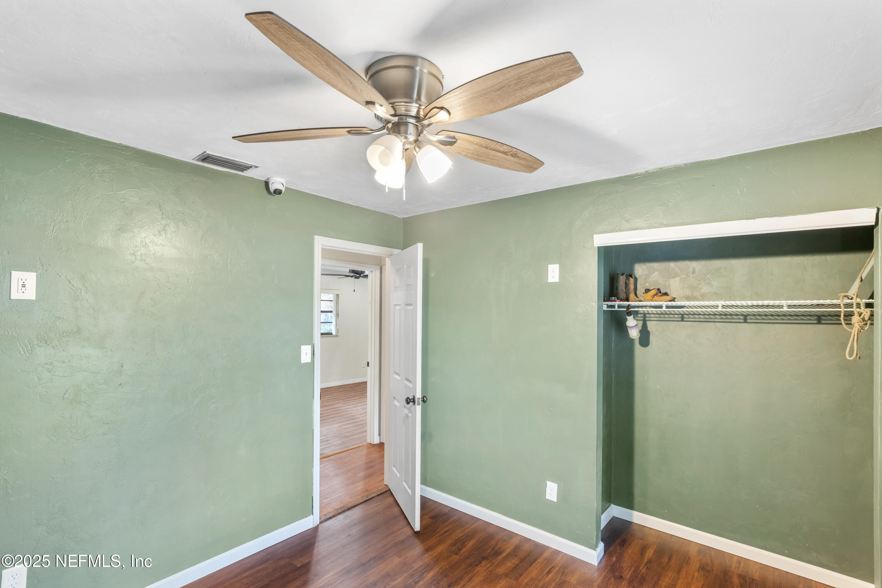 220 Southwest Grove Street Keystone Heights, FL 32656 - Photo 29 of 41 a view of an empty room with wooden floor