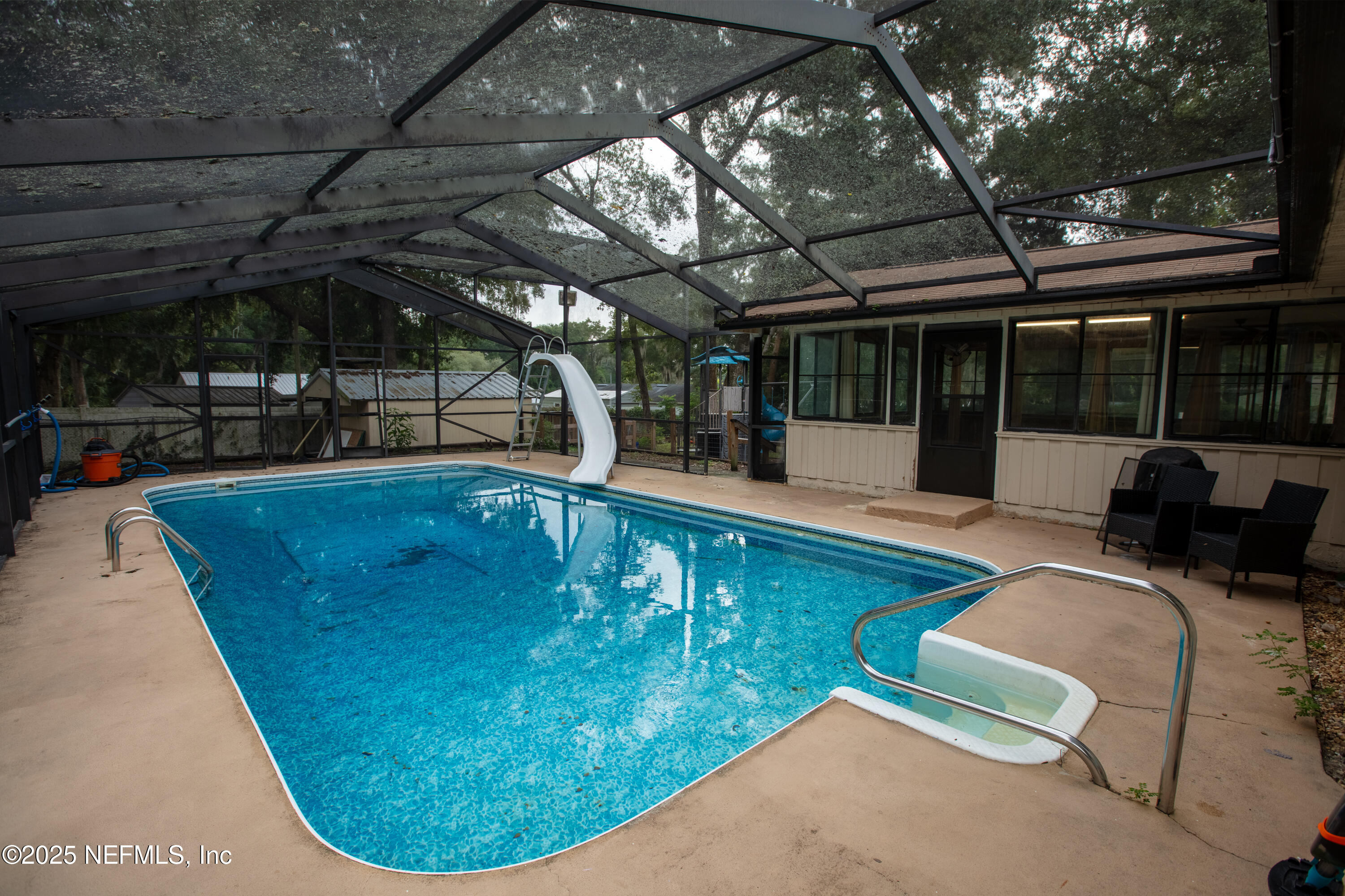 220 Southwest Grove Street Keystone Heights, FL 32656 - Photo 33 of 41 a view of a swimming pool with a patio