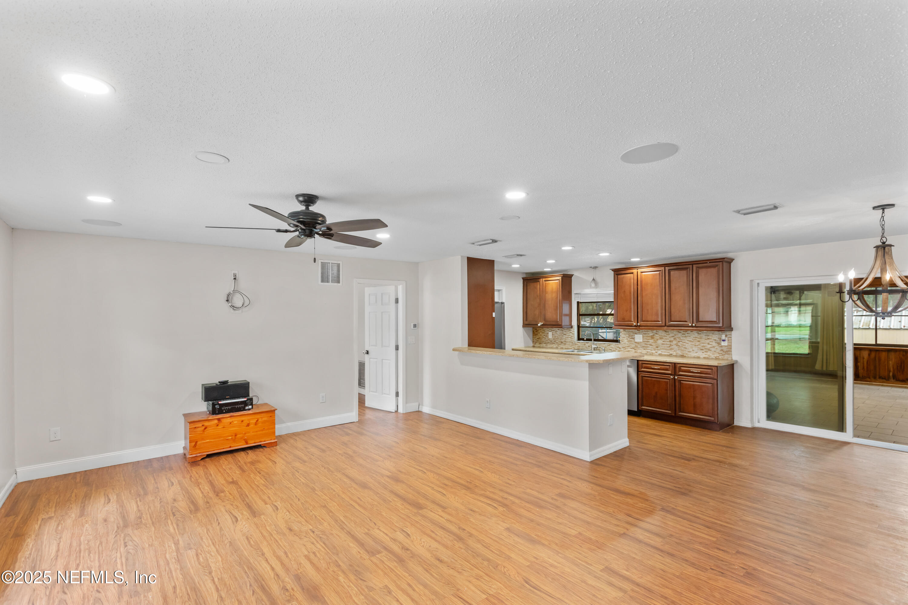 220 Southwest Grove Street Keystone Heights, FL 32656 - Photo 4 of 41 a bedroom with a bed and a view of kitchen