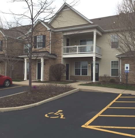 4457 Timber Ridge Court, Unit 4457 Joliet, IL 60431 - Photo 1 of 3 front view of a house with a street