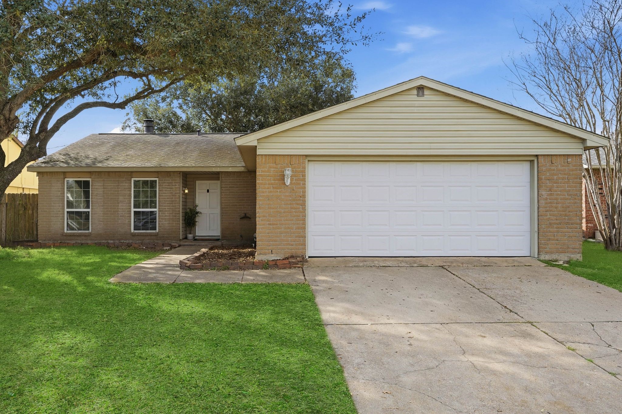 17223 Ranch Country Road Hockley, TX 77447 - Photo 2 of 36 Your front door is tucked away privately with beautiful flower beds on either side.