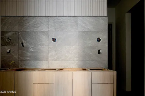 a dining room with furniture and a floor to ceiling window