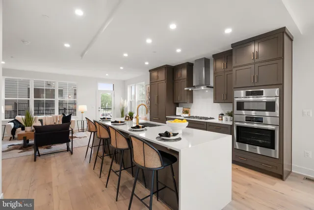 a kitchen with lots of counter space and stainless steel appliances