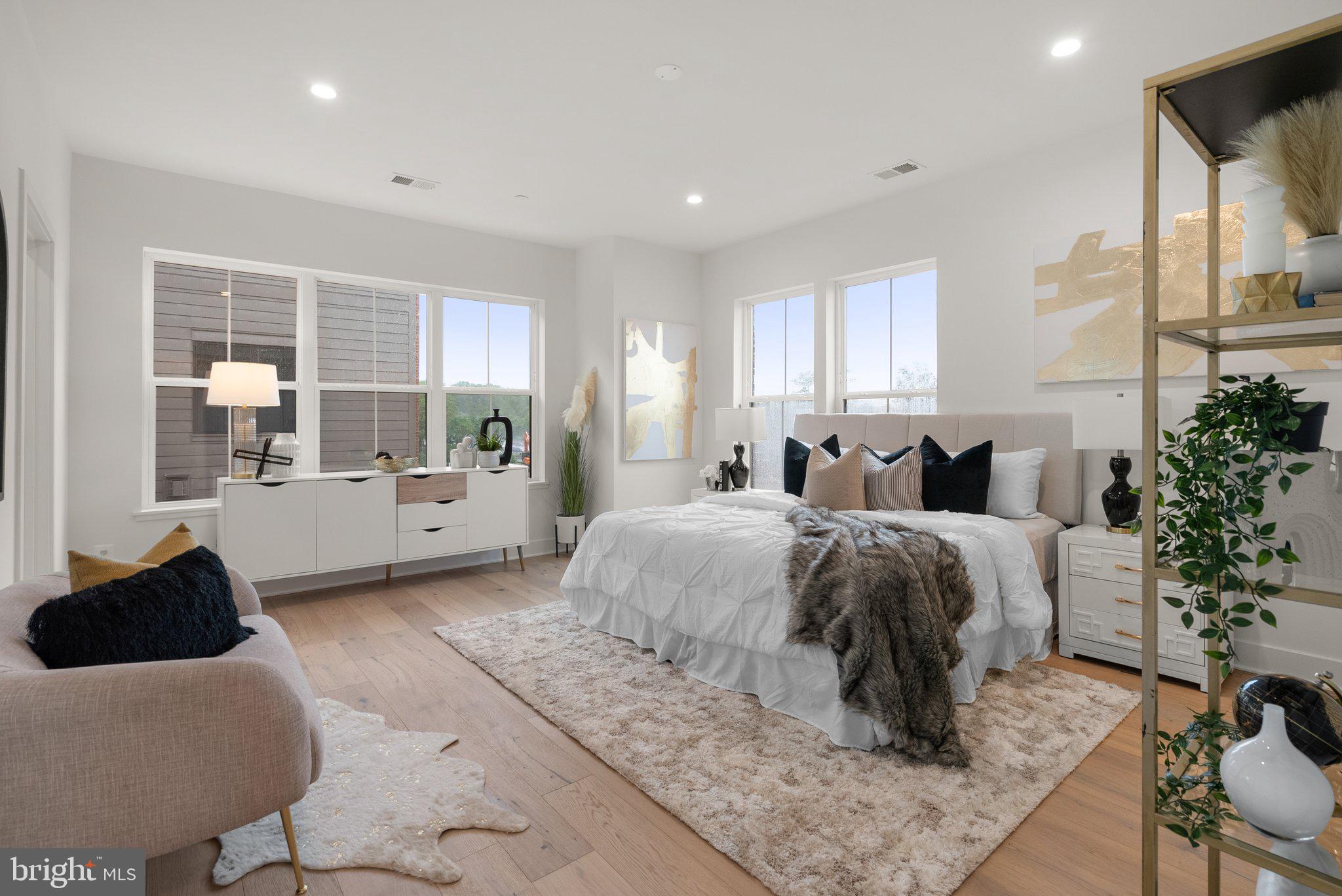 1121 Polaris Road Potomac, MD 20854 - Photo 16 of 51 a bed room with a bed and a couch