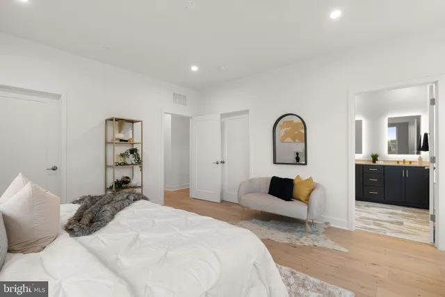 a bedroom with a bed and a couch