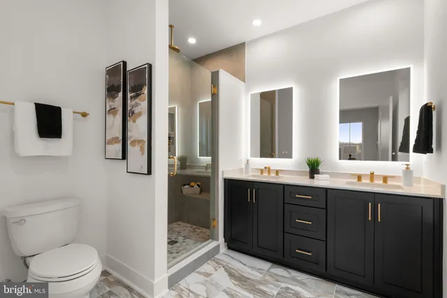 a bedroom with a bed and a large mirror